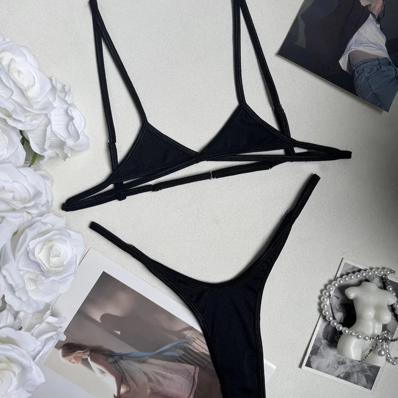 Demeter black micro bra and G-string laid flat