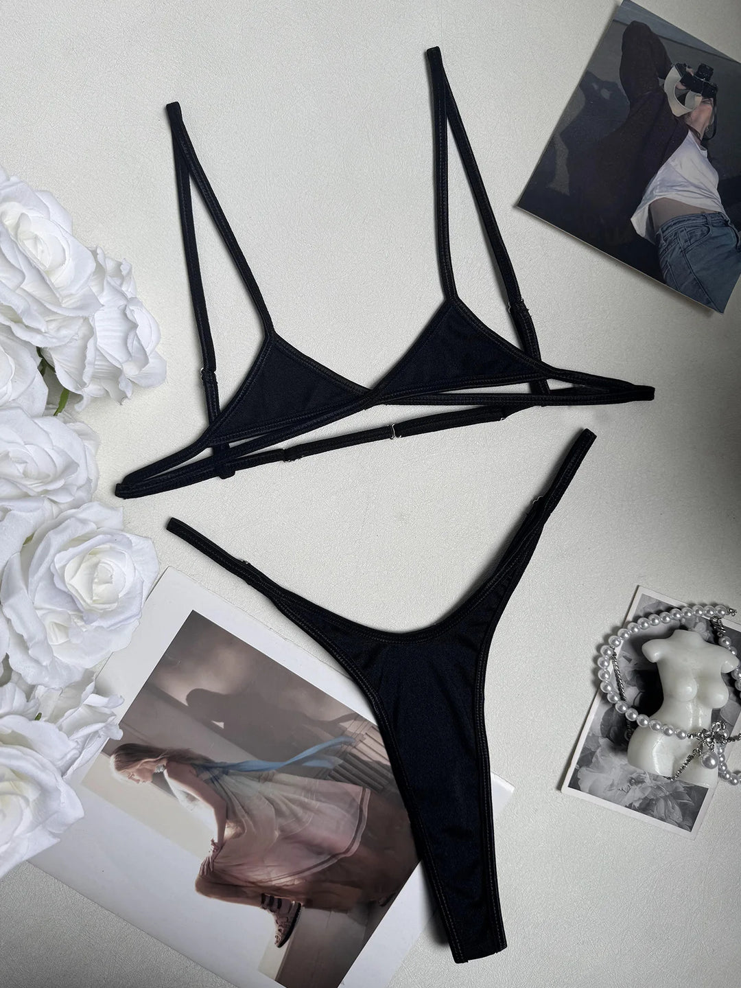 Demeter black triangle bra and G-string flat view