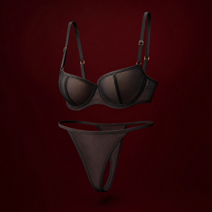 Ines sheer mesh bra and thong on a burgundy studio background