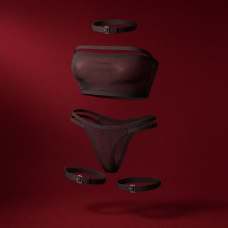 Romy four-piece sheer mesh bandeau set on a burgundy studio background